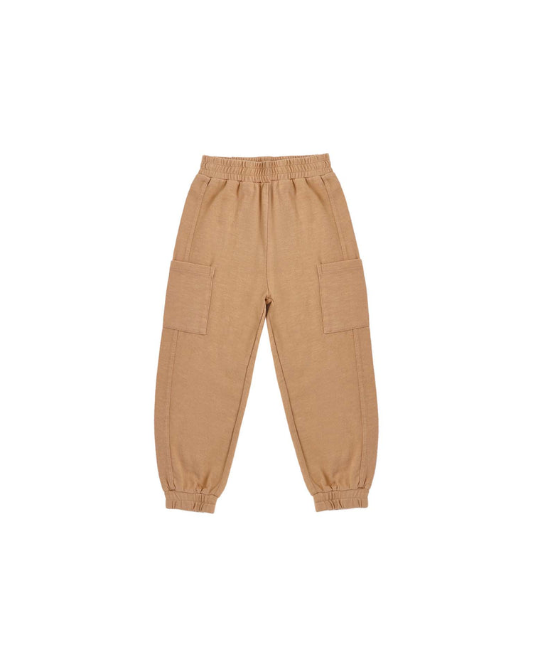 The “cargo jogger in fawn” by rylee + cru is shown on a white background, featuring a tan color, elastic waistband and cuffs, and large side cargo pockets.