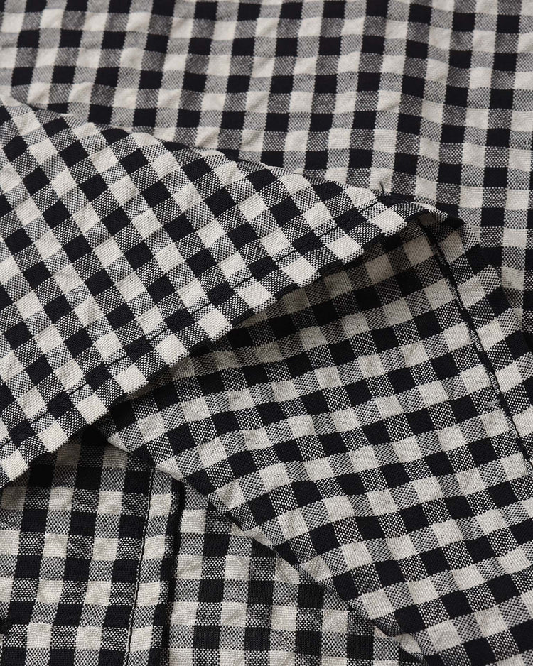 A close-up of the lapel collared shirt in black check by rylee + cru, showing its black and white gingham pattern and texture—ideal for a timeless classic boys' shirt or button up.