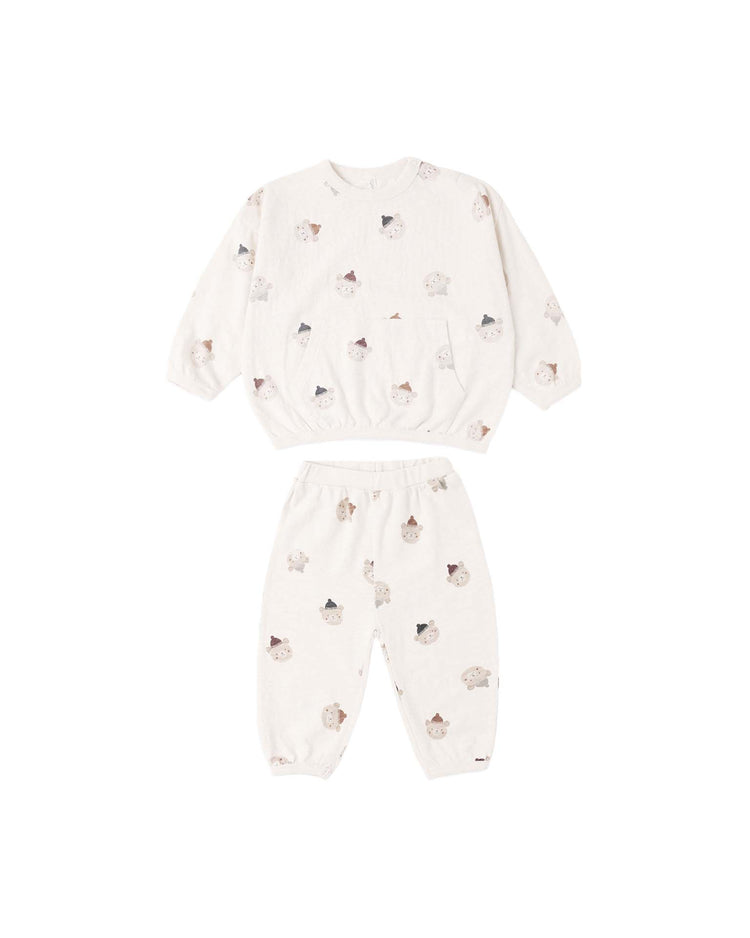 Introducing the PREORDER relaxed set in winter bears from rylee + cru—a cozy two-piece children’s pajama set made from heavy slub knit. This ivory ensemble features a long-sleeve top and pants adorned with a playful winter bears print, and is designed for comfort with elastic cuffs at the sleeves, waist, and ankles.