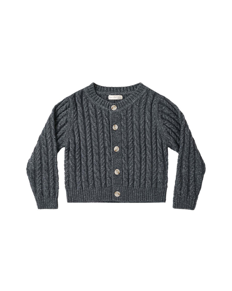 The cheyenne cardigan in midnight by rylee + cru—a dark gray, long-sleeve cable-knit layer with cozy wooden buttons—laid flat against a white background, perfect for cooler days.