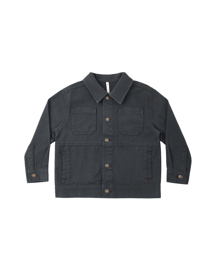 The chore coat in midnight by rylee + cru features a classic collar, long sleeves, two chest pockets with flaps, and two front slit pockets. Crafted from 100% cotton dark gray denim, this jacket is finished with brown buttons down the front as well as on the pockets and cuffs.