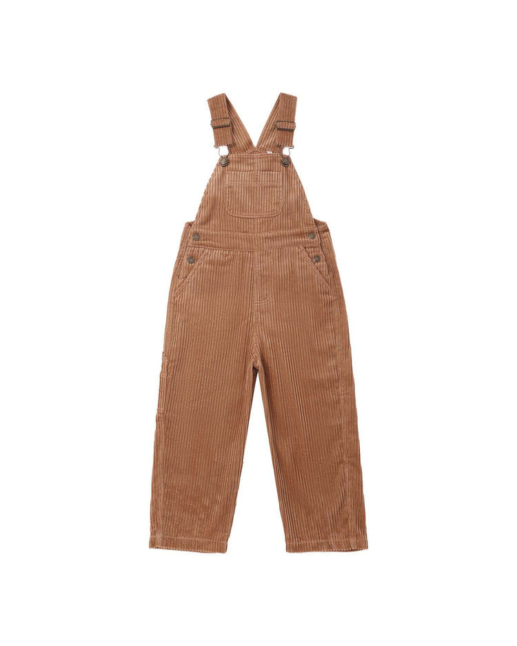 The utility overall in fawn by rylee + cru, made from 100% cotton brown corduroy with adjustable straps, a front bib pocket, side buttons, and straight legs, is shown laid flat against a white background.