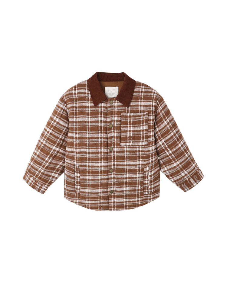 The nashville quilted jacket in aspen plaid by rylee + cru features a classic brown and white plaid design, long sleeves, a dark brown collar, front button closure, and a single chest pocket—offering timeless comfort for your wardrobe.