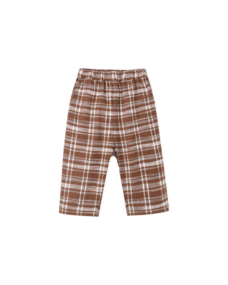 The palmer pant in aspen plaid by rylee + cru is a children’s mid-length style featuring an elastic waistband and a relaxed, baggy fit for comfortable wear. Displayed against a white background, these pants showcase a brown plaid pattern with light brown and white lines.