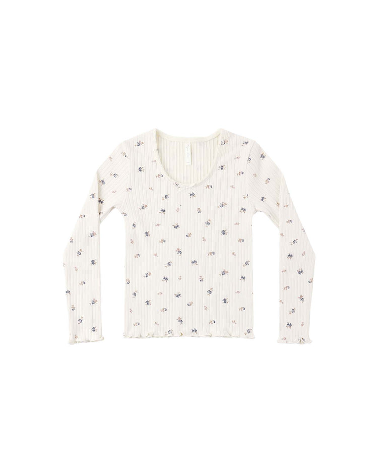 The ribbed long sleeve in natural ditsy by rylee + cru features a cream base with a scoop neckline and an allover print of pink and blue florals. Lettuce edge trim accents the sleeves and hem, adding extra charm to this long-sleeve top.
