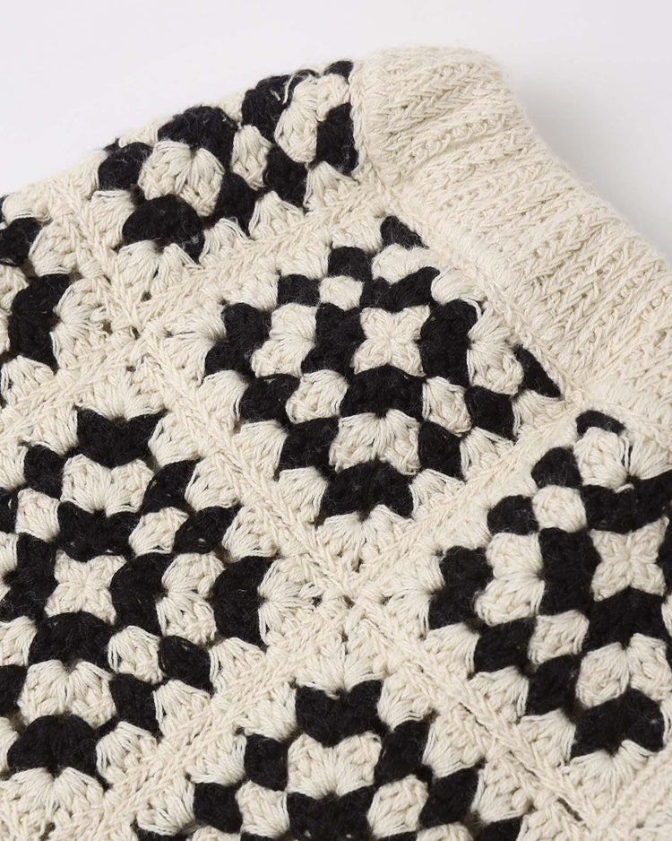 Close-up of the kira set in abstract by rylee + cru, showing a sleeveless crochet top in black and off-white with geometric motifs and a ribbed edge.