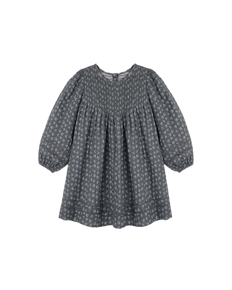 The rylee + cru selene dress in heart ditsy is a gray vintage-inspired mini dress featuring puff sleeves, elastic cuffs, a gathered yoke, and an all-over small white heart ditsy print, shown on a white background.