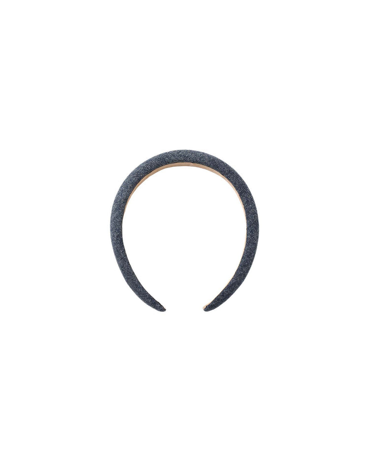 The padded headband in indigo by rylee + cru is crafted from 100% cotton denim, featuring a simple, wide design in a dark blue shade and displayed on a plain white background.