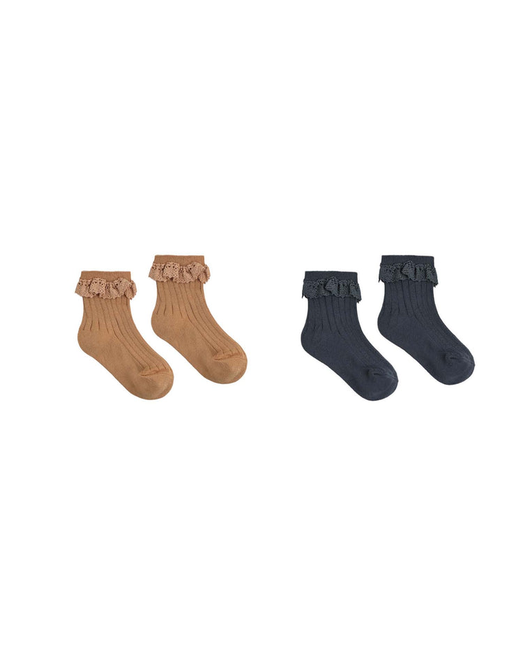 Two pairs of ultra-soft rylee + cru lace trim socks in fawn and midnight feature a cozy rib knit design with delicate lace edging. Both charming pairs are displayed on a white background.