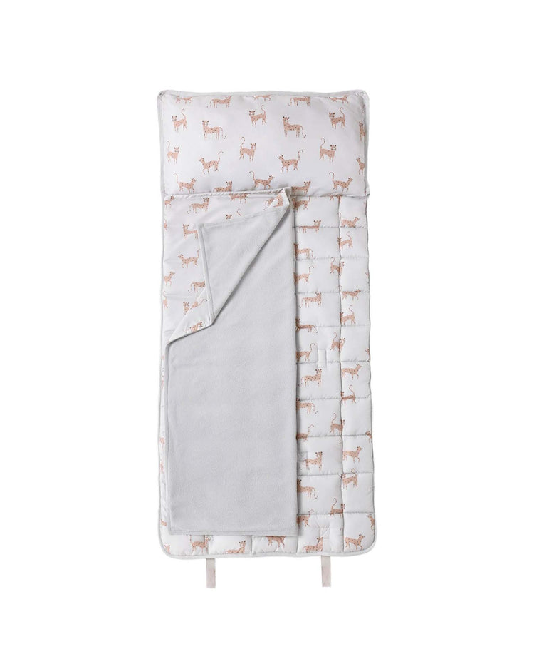 A children's nap mat in leopard by rylee + cru, featuring a removable pillow and a soft micro-fleece blanket with a stylish leopard print and a plain light gray inner blanket, all neatly arranged on a white background.