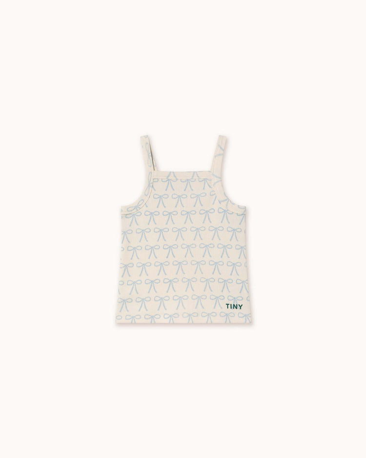 The off-white bows strap top by tiny cottons is crafted from organic cotton and features light blue bow patterns, twin straps, and a distinctive small black "Tiny Cottons" label at the bottom, making its unique prints stand out effortlessly.