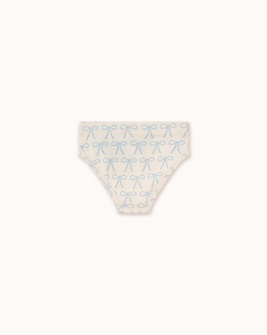 Discover Tiny Cottons' off-white children's briefs adorned with charming light blue bows. Made from soft organic cotton, these essentials provide comfort and distinctive designs for your little one.