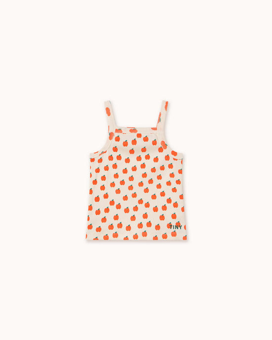 The tiny cottons apples strap top for children is off-white with an orange apple pattern and made from high-quality organic cotton.