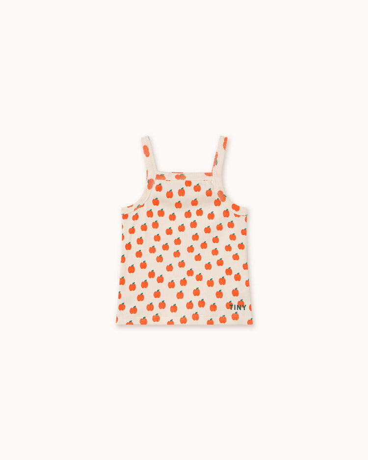 The tiny cottons apples strap top for children is off-white with an orange apple pattern and made from high-quality organic cotton.
