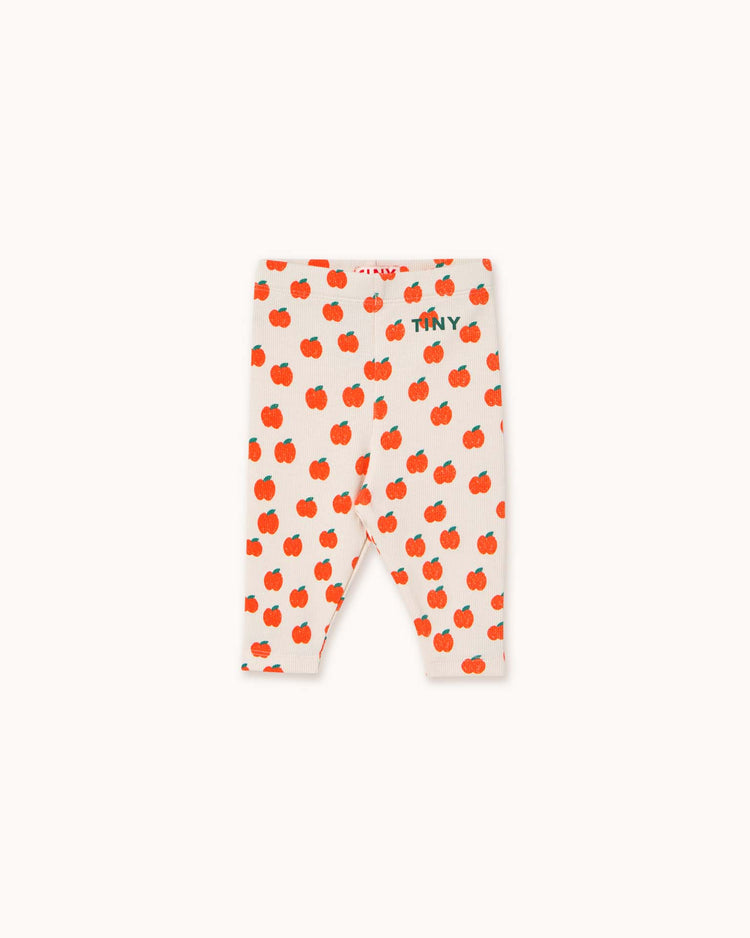 Check out tiny cottons' apples baby rib pant in off-white, featuring playful red apple prints with "TINY" near the waistband for a stylish and comfortable look.