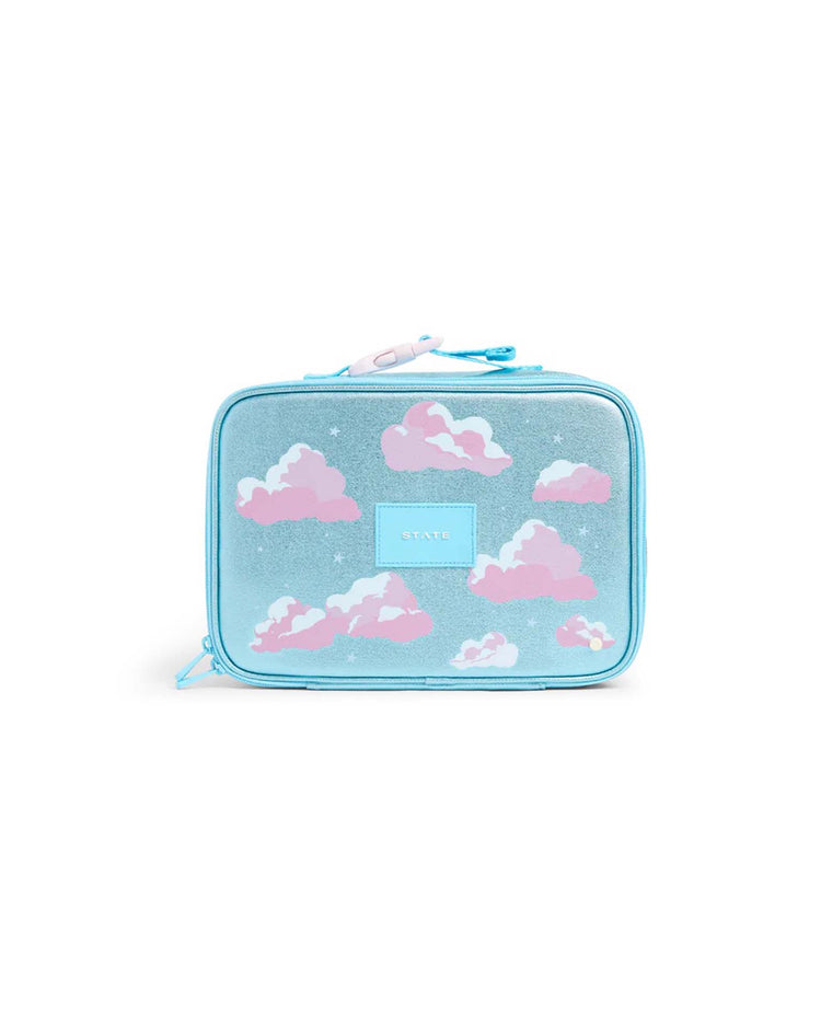 The State Bags Rodgers Lunch Box in Clouds features a light blue design adorned with pink and white clouds, silver glitter accents, and a blue zipper. The brand's label is prominently displayed at the front center, giving this kids' lunch box a playful yet stylish look.