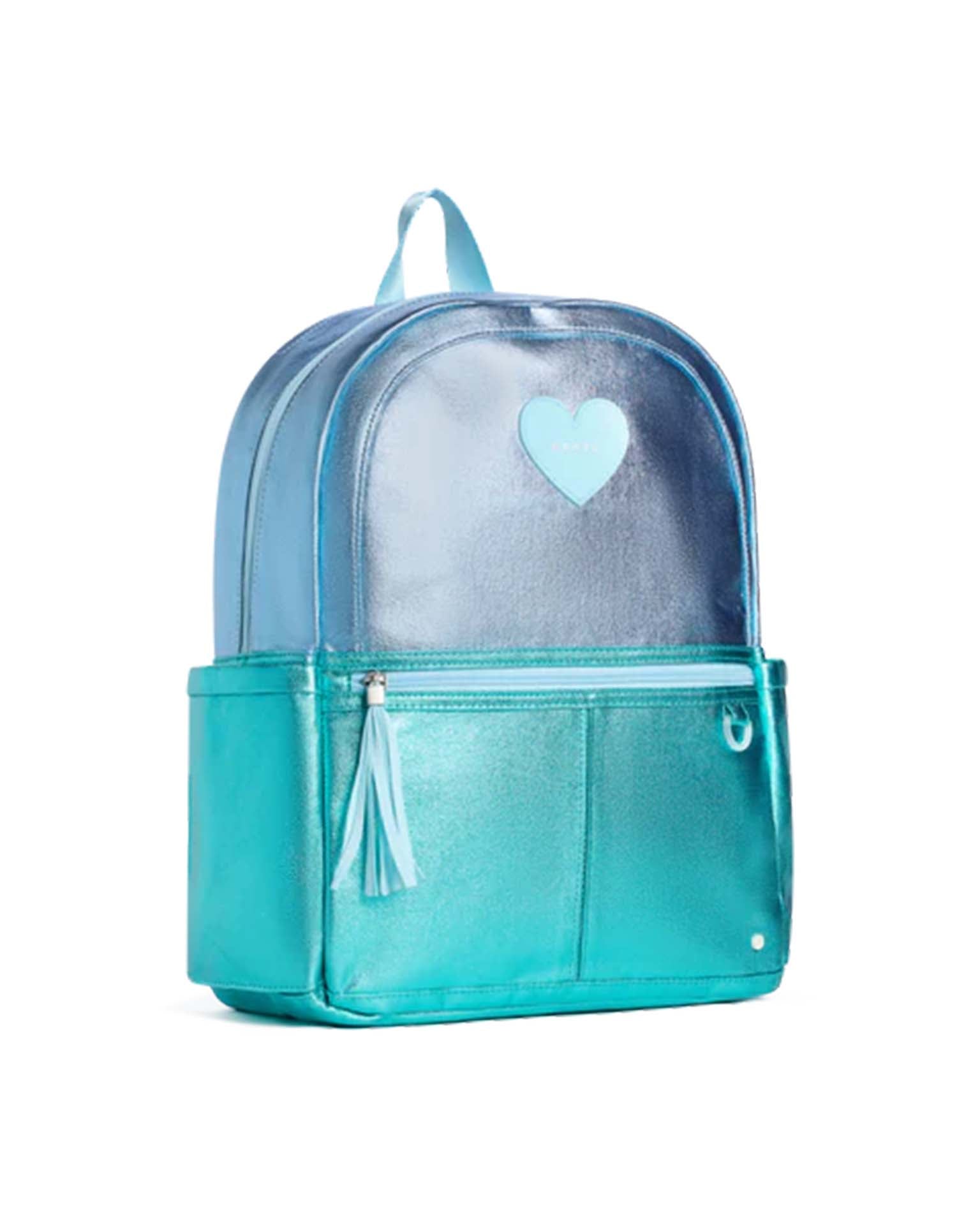 The kane backpack in blue + turquoise colorblock from state bags features a heart emblem on the front pocket, two side pockets, a zipper with a tassel, and a top handle. Inspired by State Bags’ popular Kane travel backpack, this stylish and functional bag is perfect for everyday use.