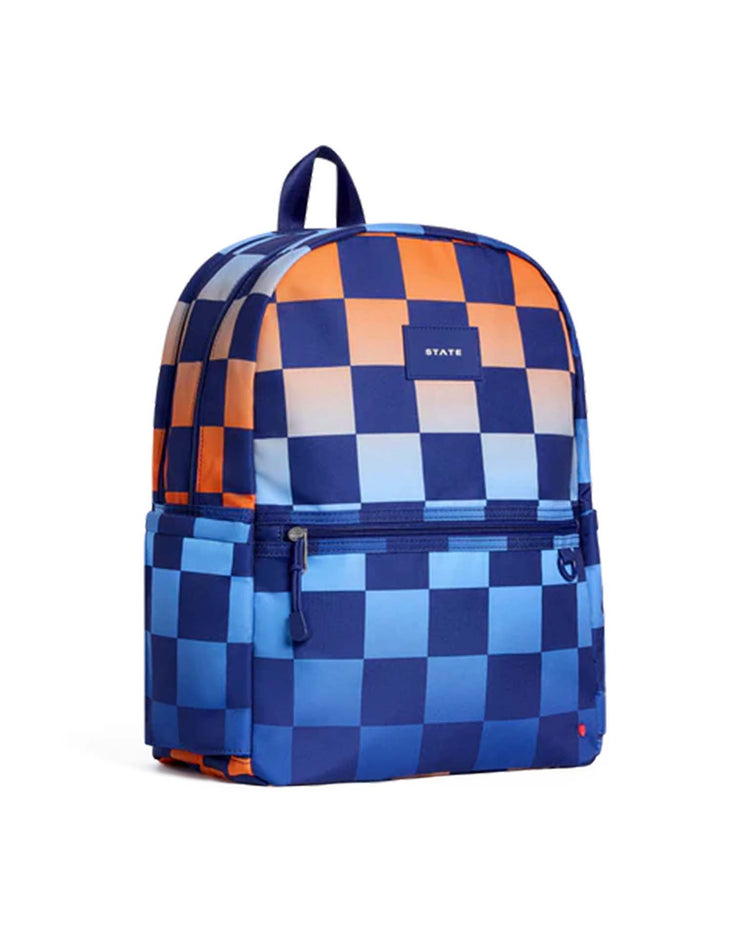 Discover the Kane Double Pocket Backpack in Gradient Checkerboard by STATE Bags—a stylish backpack showcasing a blue, light blue, and orange checkerboard pattern. It features dual front zipper pockets, convenient side pockets, and a sturdy top handle—perfect for everyday use as a school backpack.