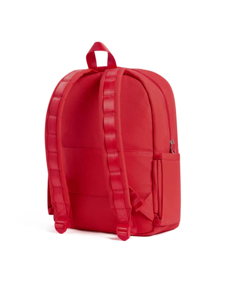 The state bags Kane backpack in red is pictured from the back, featuring padded shoulder straps, a top carrying handle, and side pockets, all set against a plain white background.