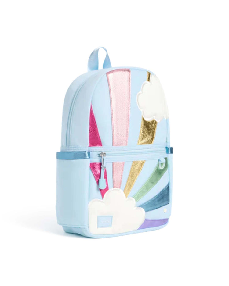 Introducing the kane mini backpack in rainbow cloud by state bags—a light blue kids’ backpack featuring colorful metallic stripes, whimsical white cloud appliqués, a convenient front zip pocket, and a sturdy top handle for playful everyday adventures.