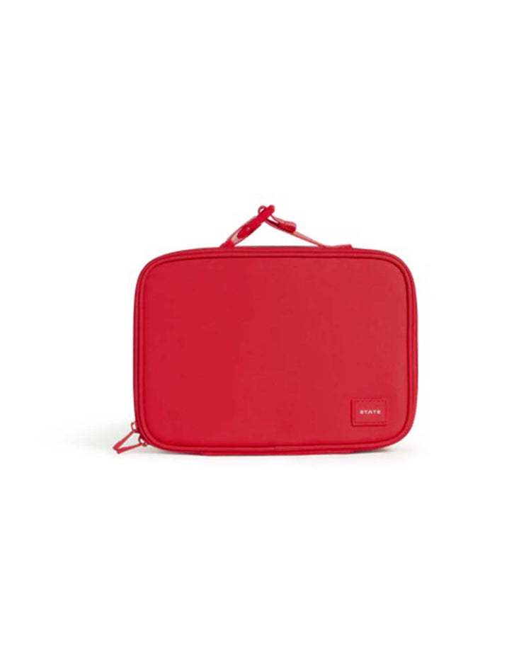 The rodgers lunch box in red by State Bags is a rectangular, bright red insulated pouch with a zippered closure, a small handle on top, and a patch label in the lower right corner—perfect as a kids lunch box, shown here against a white background.