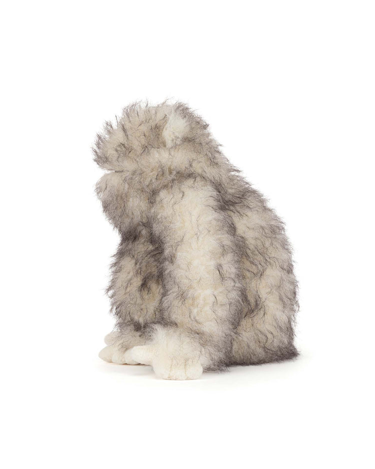 The jellycat bretti yeti is a soft toy with fluffy gray and white fur, sitting upright and facing slightly left on a white background—a charming addition to any stuffed animal collection.