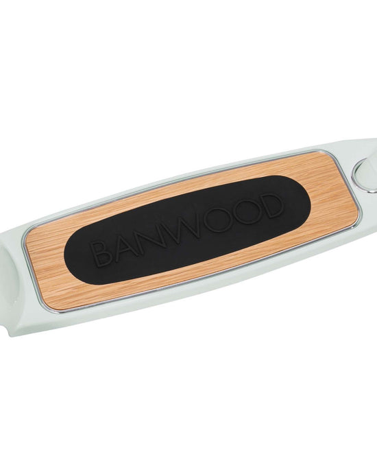 Close-up of the banwood scooter in mint shows a wooden-finish deck with a large black BANWOOD grip and highlights its Easy Ride Steering System on this three-wheeled kick scooter.