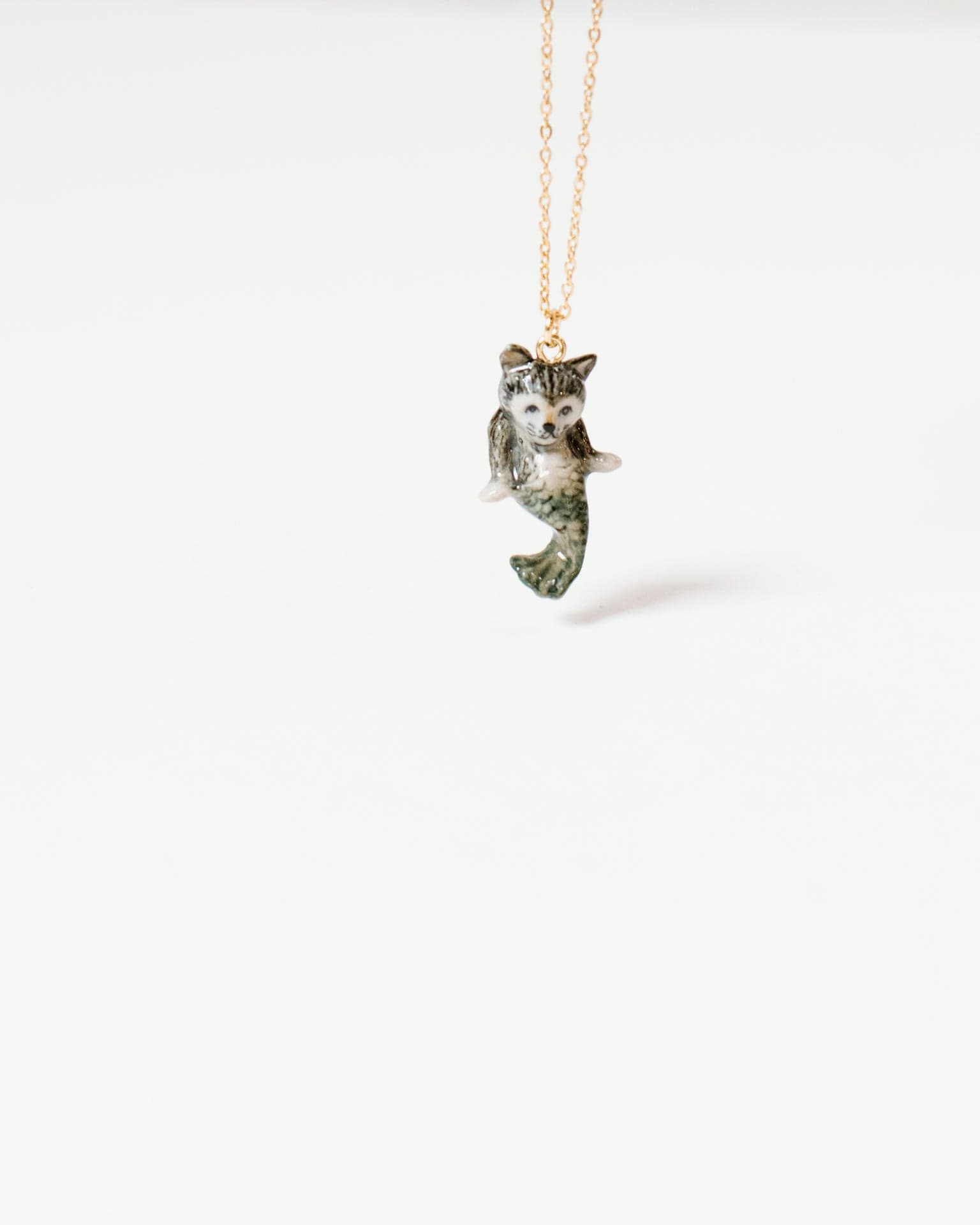 https://www.boutiquelittle.com/cdn/shop/files/little-camp-hollow-catfish-necklace-41419082498340.jpg?v=1683206876