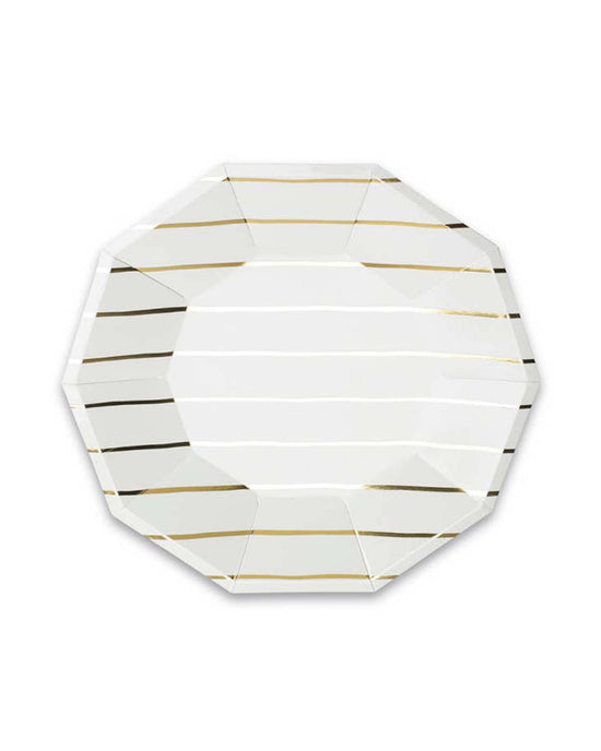 The gold Frenchie striped small plate from Daydream Society is an octagonal white plate adorned with gold and black horizontal stripes, reminiscent of the classic French Breton stripe, displayed on a white background.