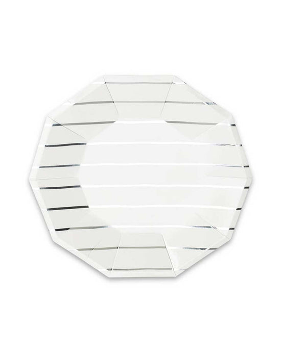 The "Silver Frenchie Striped Large Plates" by Daydream Society are elegant, clear glass octagonal plates with subtle horizontal lines across their surface, making them perfect for pairing with striped napkins.