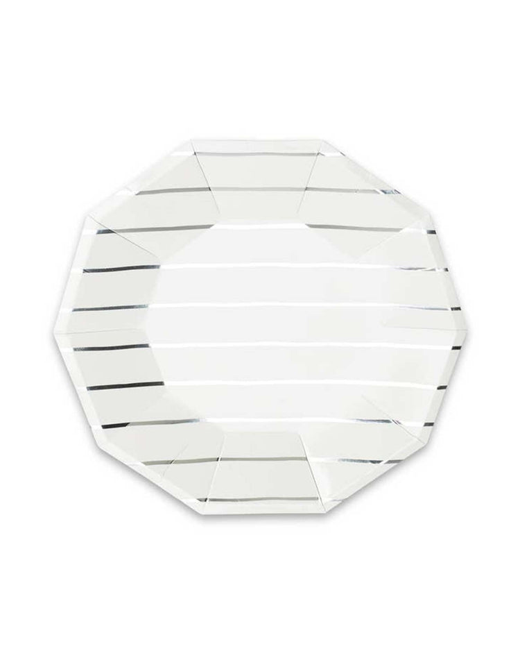 The "Silver Frenchie Striped Large Plates" by Daydream Society are elegant, clear glass octagonal plates with subtle horizontal lines across their surface, making them perfect for pairing with striped napkins.