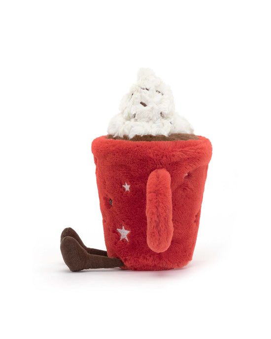 A charming plush toy resembling a cozy mug with star patterns, filled with a white whipped cream-like topping and a small brown handle, just like the Jellycat Amuseable Hot Chocolate.
