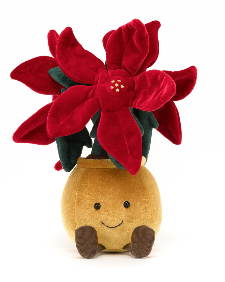 The Jellycat Amuseable Poinsettia is a plush toy featuring a potted plant with large, red petals and a smiling face on the pot, making it the perfect holiday companion.