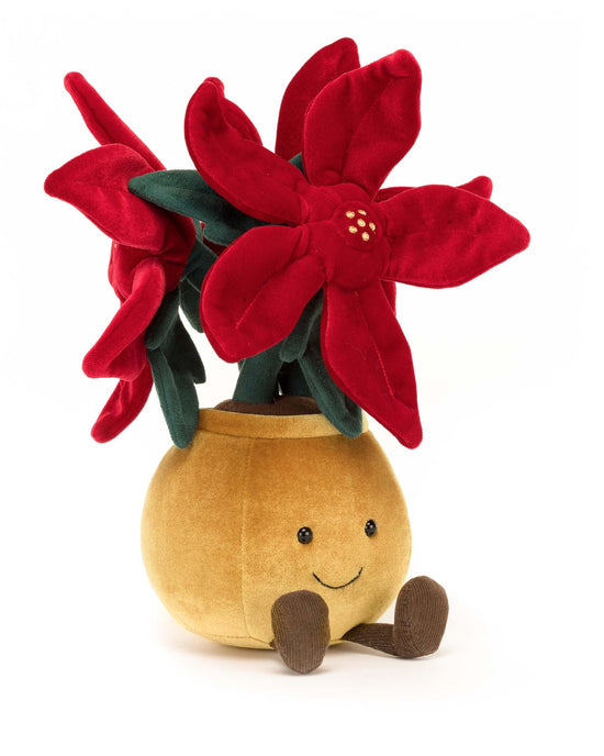The Jellycat Amuseable Poinsettia is a plush toy resembling a smiling, stylish plant with red petals and green leaves, perfect as a holiday companion or gift.