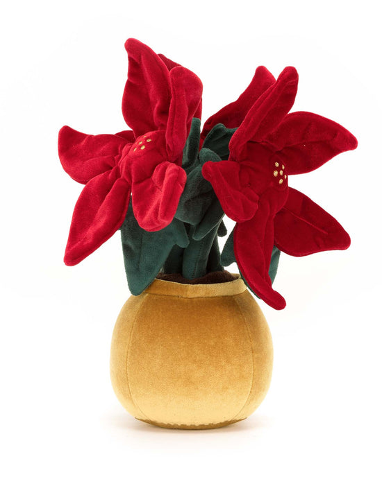 The amuseable poinsettia by Jellycat, a plush toy resembling a potted plant with red flowers and green leaves in a stylish, yellow pot, makes the perfect holiday companion.