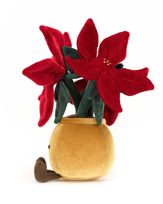 This Jellycat Amuseable Poinsettia plush toy portrays a pot with vibrant red poinsettia flowers and a small brown stem emerging from the base, making it a stylish plant and perfect holiday companion.