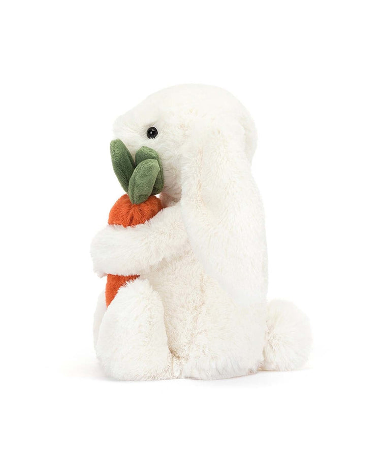 Meet the bashful carrot bunny little by Jellycat—an adorable white plush bunny holding an orange and green stuffed carrot, perfect for snuggles and playtime.