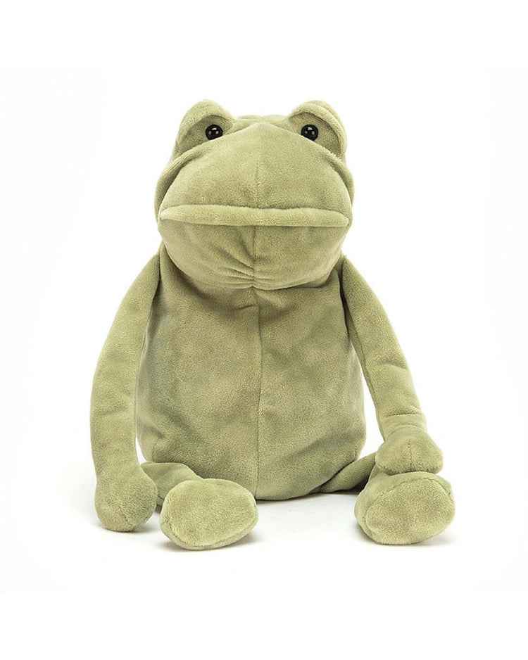 A green plush frog, named Fergus Frog and made of soft velour by Jellycat, sits upright against a plain white background, with black eyes gazing forward.