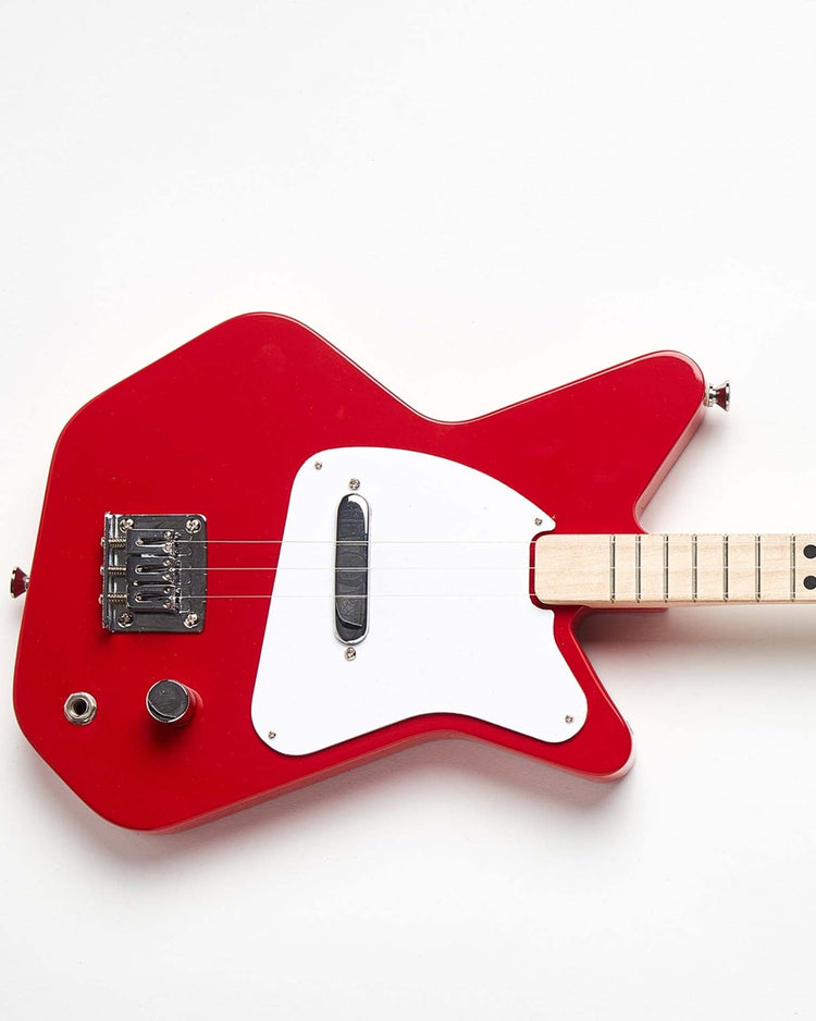A Loog Pro Electric in red, featuring a white pickguard and minimalistic design, perfect for a beginner guitarist, showcased against a white background.