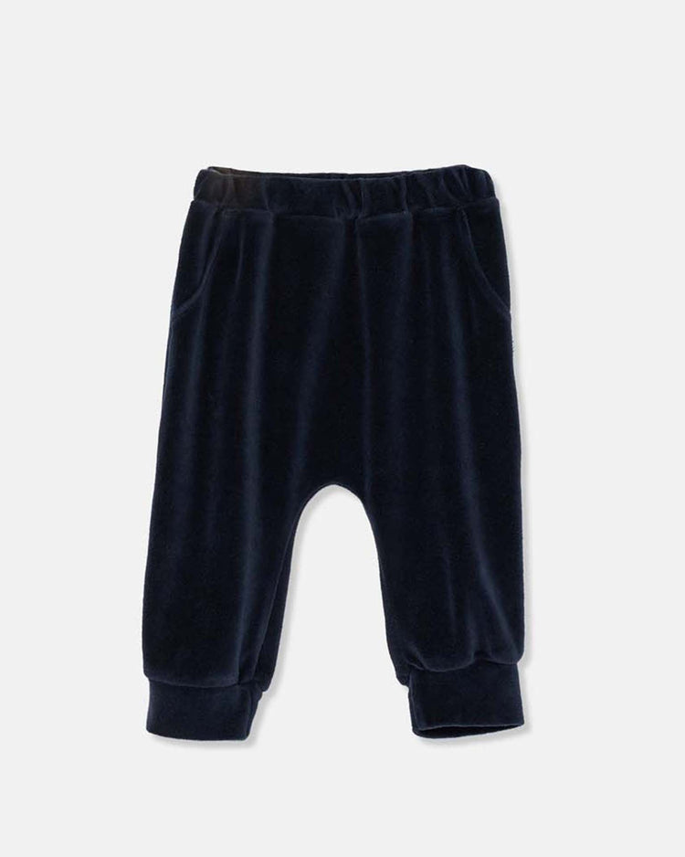 The cozmo chris velour baby pants in navy feature an elastic waistband, side pockets, and cuffed ankles in a soft fabric—ideal for little ones. Shown on a plain light background.