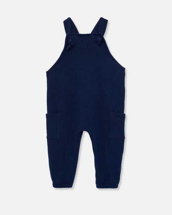 The ronie knit baby overalls in navy from cozmo feature shoulder straps, two front pockets, and a straight-leg design, crafted with soft textiles and shown on a plain white background.