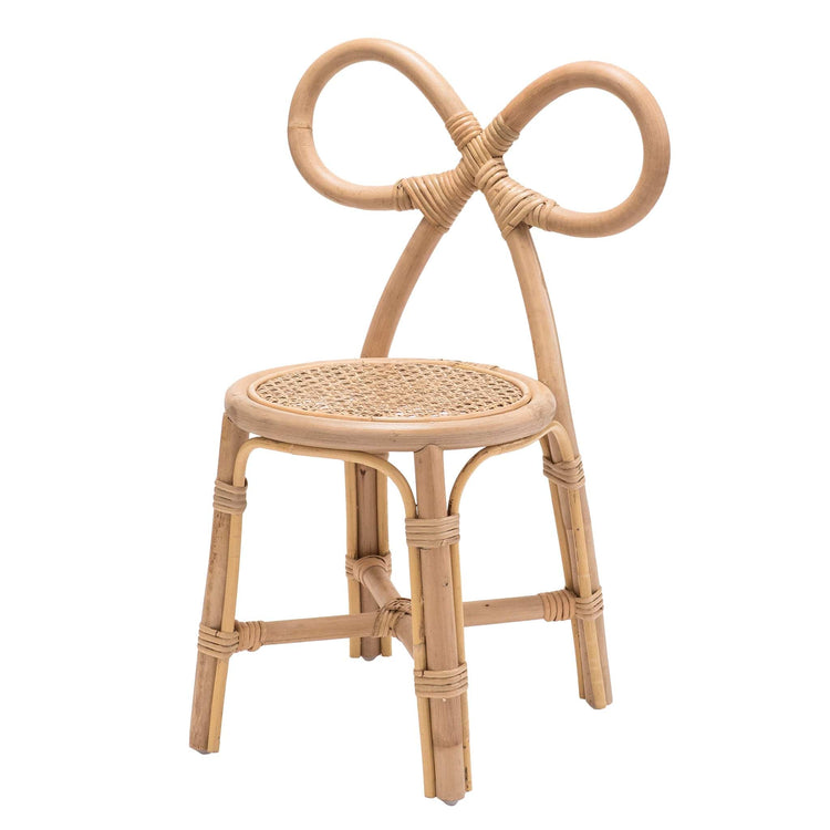 The poppie toys Poppie Bow Chair features a looped, bow-shaped backrest and woven cane seat in natural wood tones—an adorable kids chair or chic vanity piece.