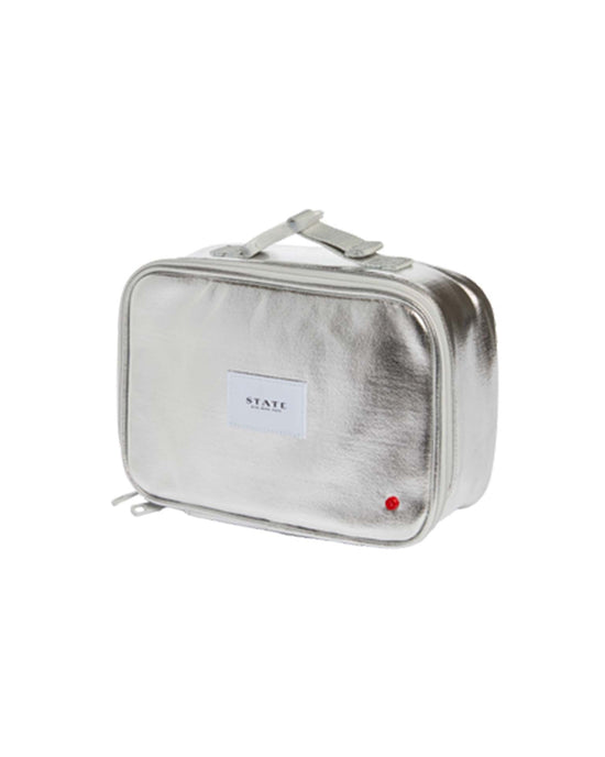 Metallic silver rectangular toiletry bag by STATE BAGS with zip closure, top handle, and front white STATE label. Features an insulated main compartment inspired by the Rodgers Lunch Box in Silver - Old SKU.