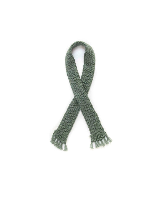 A cozy bear-striped sweater with a green scarf by tun tun, arranged in a crisscross pattern on a white background, evoking the charm of handmade heirloom-quality toys.