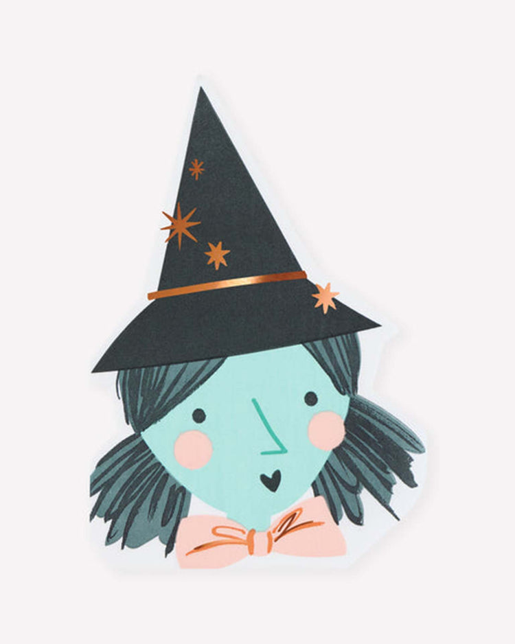 Add a magical touch to your party table setting with meri meri’s witch shaped napkins, featuring a charming drawing of a smiling girl with blue skin, black hair in pigtails, wearing a pointy black witch hat adorned with orange stars and a large peach-colored bow under her chin—an enchanting design that’s perfect for any celebration.