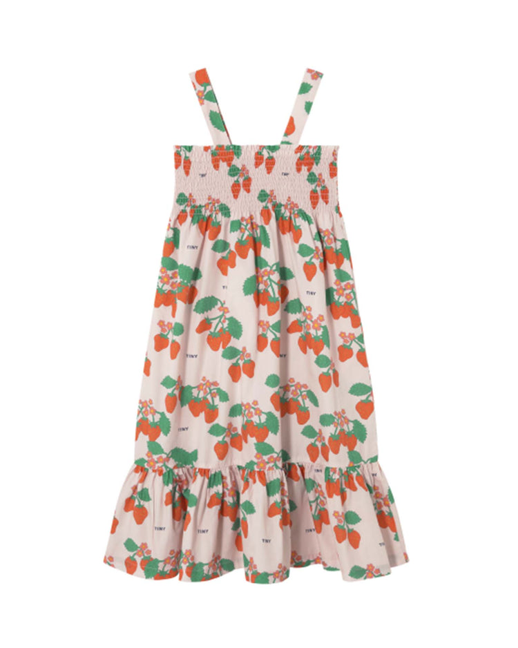 Tiny Cottons' strawberries woven dress in pastel pink showcases a high-quality piece with a smocked bodice, unique strawberry prints, ruffled hem, and charming shoulder straps.