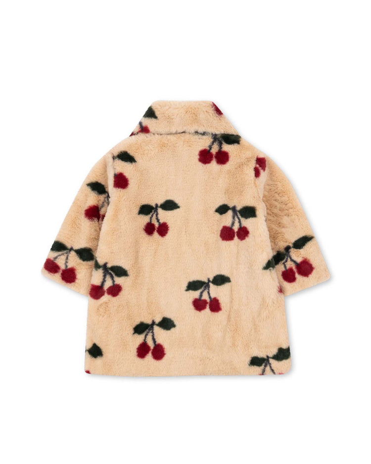 Introducing the "fuzzie coat in ma grande cerise" by konges sløjd—a beige plush coat made from GRS-certified polyester, beautifully adorned with a delightful cherry pattern of red cherries and green leaves scattered across the fabric. Displayed flat to highlight the back, this stylish coat is finished with a rounded collar for added charm.