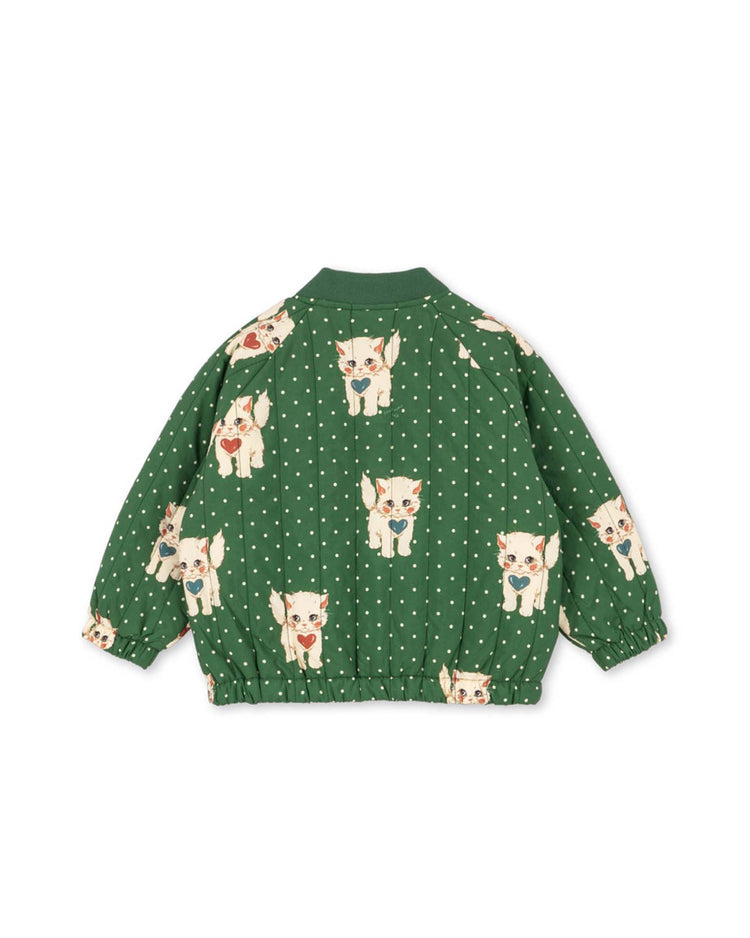 The "juno printed bomber jacket in dot miao verde" by konges sløjd features a playful pattern of cartoon cats and white polka dots on a green background. This lightweight thermo jacket is both water-repellent and wind-resistant, making it perfect for stylish protection on breezy, drizzly days.