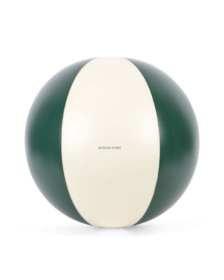 The konges sløjd beach ball in green stripe features alternating dark green and white panels with the brand logo on the center, making it a stylish inflatable accessory for the pool or beach.