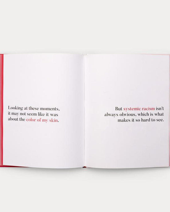 An open book reveals two pages of text discussing the challenges of recognizing systemic racism, mentioning how certain moments might not appear related to someone's skin color in a narrative style reminiscent of *a kids book about systemic racism* by Random House.